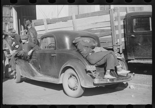 Very often farmers must travel long distances at night or wait several days for tobacco to be sold. They can be found sleeping on the covered piles of tobacco in warehouses or in their trucks or the floors of camp rooms. Durham, North Carolina