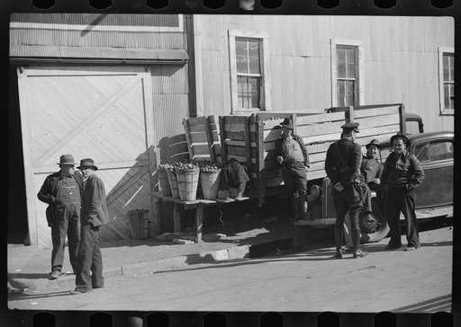 Untitled photo, possibly related to: Outside tobacco warehouse after auction sale. Durham, North Carolina