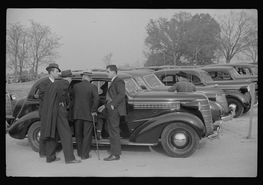 Untitled photo, possibly related to: Cars parked outside the stadium at the Duke University-North Carolina football game. Durham, North Carolina
