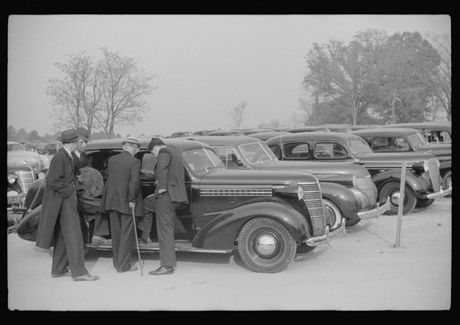 Cars parked outside the stadium at the Duke University-North Carolina football game. Durham, North Carolina