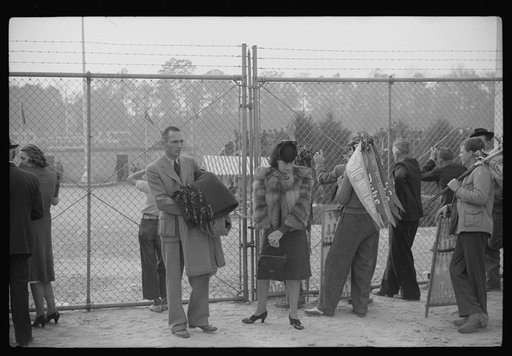 Spectators outside of the gate at Duke University-North Carolina football game. Durham, North Carolina