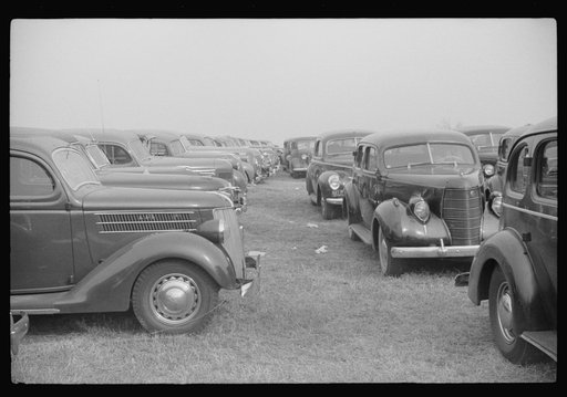 Untitled photo, possibly related to: Cars parked outside the stadium at the Duke University-North Carolina football game. Durham, North Carolina