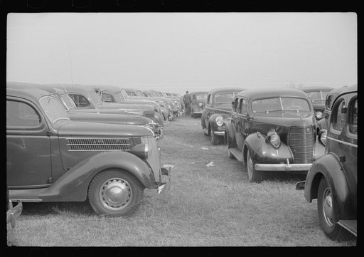 Untitled photo, possibly related to: Cars parked outside the stadium at the Duke University-North Carolina football game. Durham, North Carolina