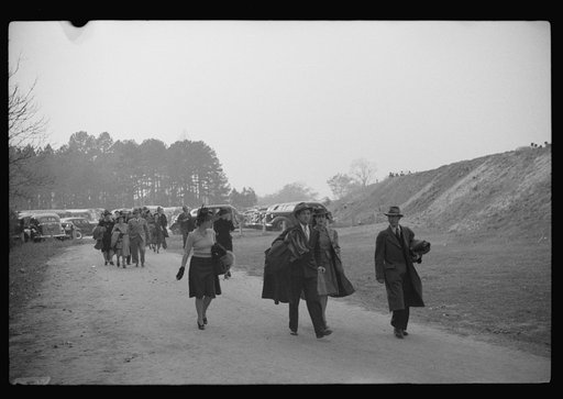 Untitled photo, possibly related to: Spectators standing outside the gate of the Duke University Stadium because there were no more seating accomodations. Duke University-North Carolina game. Durham, North Carolina