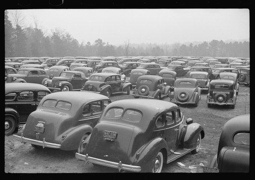 Cars parked outside the stadium at the Duke University-North Carolina game. Durham, North Carolina