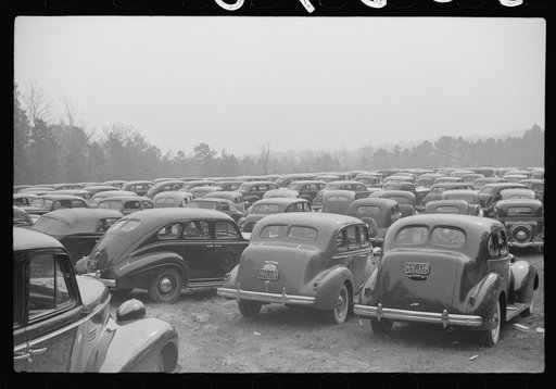 Untitled photo, possibly related to: Cars parked outside the stadium at the Duke University-North Carolina game. Durham, North Carolina