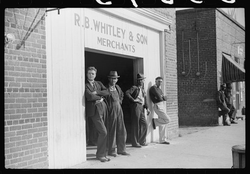 Men standing around outside general store, Wendell, Wake County, North Carolina