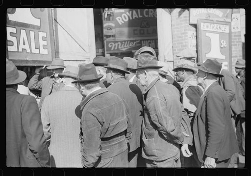 Untitled photo, possibly related to: Spectators listening to patent medicine salesman who has his stand outside tobacco warehouse during tobacco auction sales. Durham, North Carolina