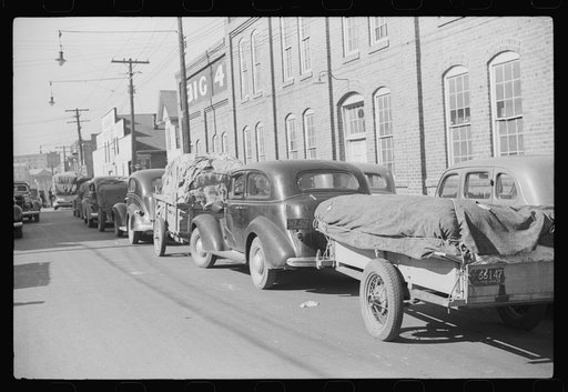 Untitled photo, possibly related to: Farmers bringing tobacco to warehouse in trailers, on top of their cars and even inside their cars for auction. Durham, North Carolina
