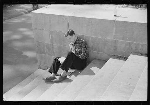 Student reading his mail during change of classes. University of North Carolina, Chapel Hill, North Carolina