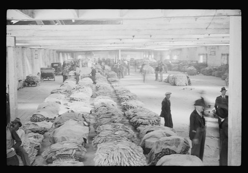 Untitled photo, possibly related to: Tobacco auction in large warehouse, Durham, North Carolina