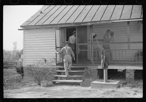 Untitled photo, possibly related to: Men who were helping with corn shucking going into house to wash up before dinner. Fred Wilkins farm. Tally Ho, near Stem, Granville County, North Carolina