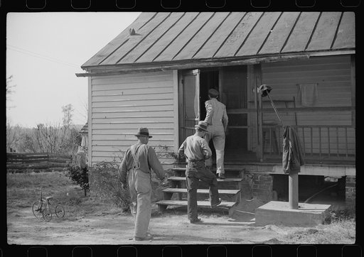 Men who were helping with corn shucking going into house to wash up before dinner. Fred Wilkins farm. Tally Ho, near Stem, Granville County, North Carolina
