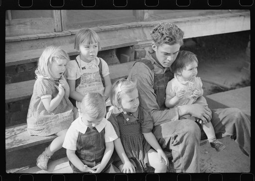 Untitled photo, possibly related to: Some of the children of the Wilkins clan on corn shucking day. Tally Ho, near Stem, Granville County, North Carolina