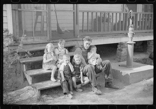 Untitled photo, possibly related to: Some of the children of the Wilkins clan on corn shucking day. Tally Ho, near Stem, Granville County, North Carolina