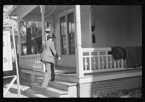 Untitled photo, possibly related to: Mr. Evan Wilkins with butter he is selling which was made on his farm, Durham, North Carolina
