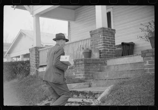 Mr. Evan Wilkins with butter he is selling which was made on his farm, Durham, North Carolina