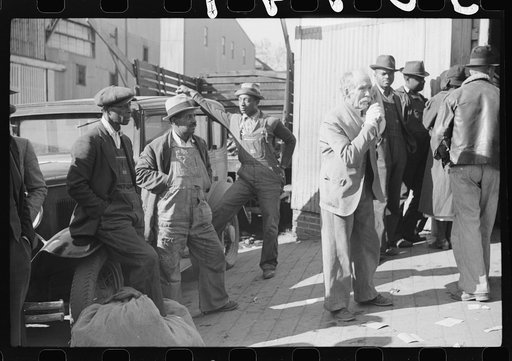 Untitled photo, possibly related to: Itinerant preacher spreading "religion" to farmers outside warehouse while tobacco auction sales are going on. Durham, North Carolina