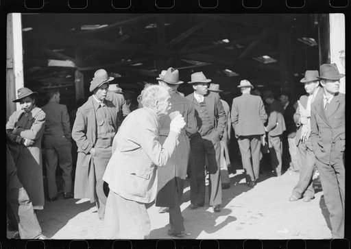 Untitled photo, possibly related to: Itinerant preacher spreading "religion" to farmers outside warehouse while tobacco auction sales are going on. Durham, North Carolina