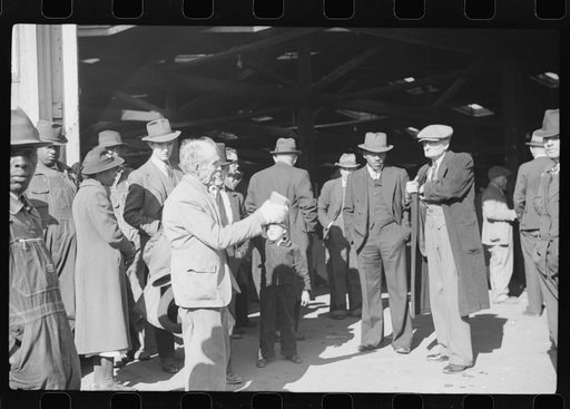 Untitled photo, possibly related to: Itinerant preacher spreading "religion" to farmers outside warehouse while tobacco auction sales are going on. Durham, North Carolina