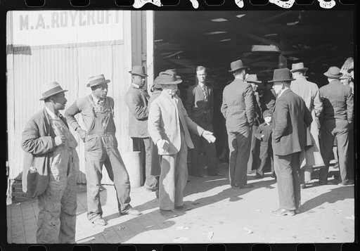 Untitled photo, possibly related to: Itinerant preacher spreading "religion" to farmers outside warehouse while tobacco auction sales are going on. Durham, North Carolina