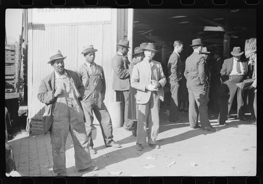 Untitled photo, possibly related to: Itinerant preacher spreading "religion" to farmers outside warehouse while tobacco auction sales are going on. Durham, North Carolina