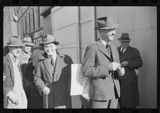 Untitled photo, possibly related to: Tobacco auctioneer carrying sign "I bet on Carolina" to pay off a wager. He had to push the warehouseman in a wheelbarrow because North Carolina lost to Duke from the warehouse to the courthouse through the streets of Durham, North Carolina
