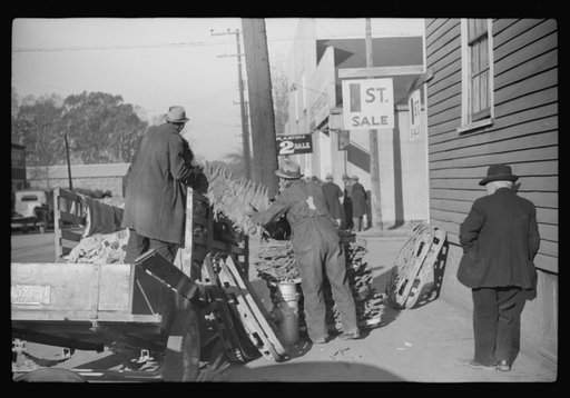 Untitled photo, possibly related to: Farmers arranging their tobacco on baskets preparatory to taking them to warehouse. It was full before the sale and there was no room to unload the tobacco. Mebane, North Carolina