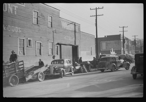 Untitled photo, possibly related to: Cars belonging to farmers loaded with tobacco which is being brought to warehouse for auction sale. Mebane, North Carolina