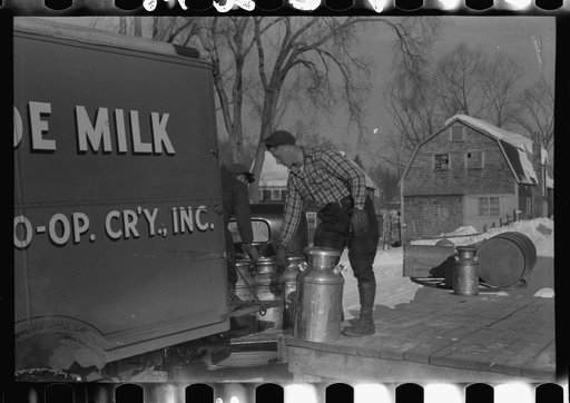 Untitled photo, possibly related to: Farmers near Woodstock, Vermont, bring their cans of milk to the crossroads early every morning where it is picked up by the coop farmers' truck and is taken to the city