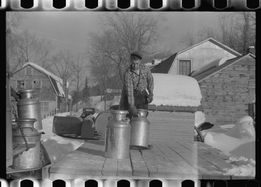 Farmers near Woodstock, Vermont, bring their cans of milk to the crossroads early every morning where it is picked up by the coop farmers' truck and is taken to the city