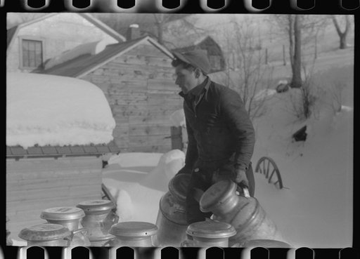 Untitled photo, possibly related to: Farmers near Woodstock, Vermont, bring their cans of milk to the crossroads early every morning where it is picked up by the coop farmers' truck and is taken to the city