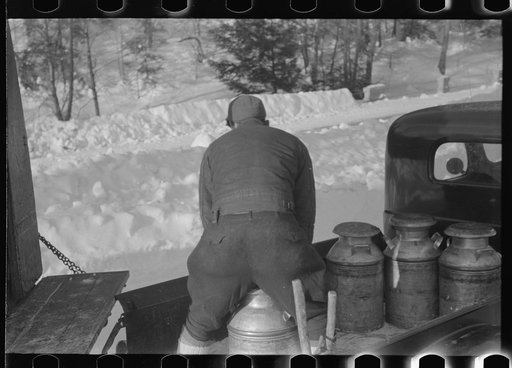 Untitled photo, possibly related to: Farmers near Woodstock, Vermont, bring their cans of milk to the crossroads early every morning where it is picked up by the coop farmers' truck and is taken to the city