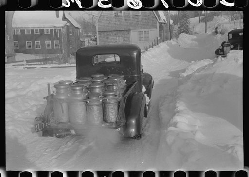 Untitled photo, possibly related to: Farmers near Woodstock, Vermont, bring their cans of milk to the crossroads early every morning where it is picked up by the coop farmers' truck and is taken to the city