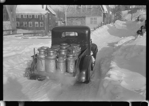 Untitled photo, possibly related to: Farmers near Woodstock, Vermont, bring their cans of milk to the crossroads early every morning where it is picked up by the coop farmers' truck and is taken to the city