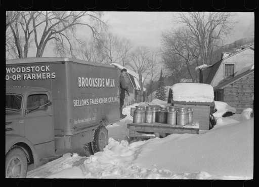 Untitled photo, possibly related to: Farmers near Woodstock, Vermont, bring their cans of milk to the crossroads early every morning where it is picked up by the coop farmers' truck and is taken to the city