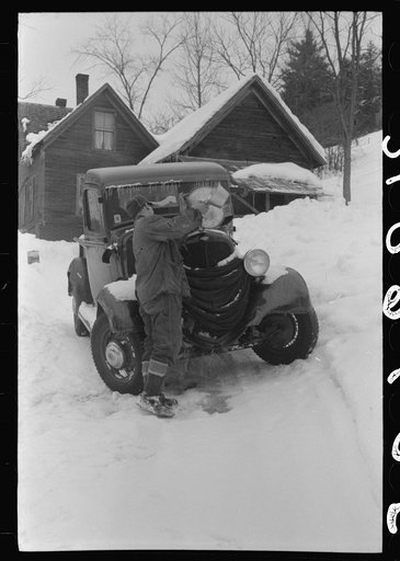 Untitled photo, possibly related to: Hired man on farm near Woodstock, Vermont, usually empties the radiator in his car every evening and refills it again with water in the morning to save the cost of antifreeze