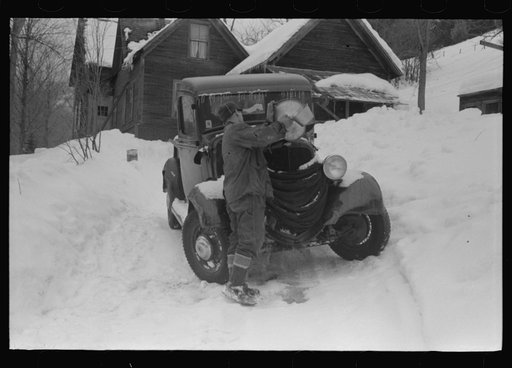 Untitled photo, possibly related to: Hired man on farm near Woodstock, Vermont, usually empties the radiator in his car every evening and refills it again with water in the morning to save the cost of antifreeze