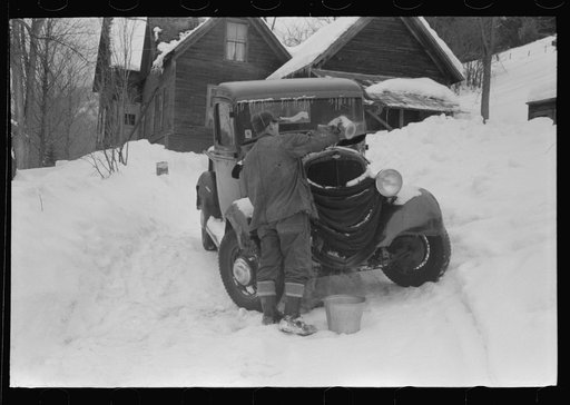 Untitled photo, possibly related to: Hired man on farm near Woodstock, Vermont, usually empties the radiator in his car every evening and refills it again with water in the morning to save the cost of antifreeze