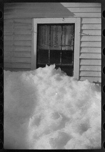 Exceptionally deep snow and sliding snow from roof almost covered the windows of many farmhouses. Woodstock, Vermont