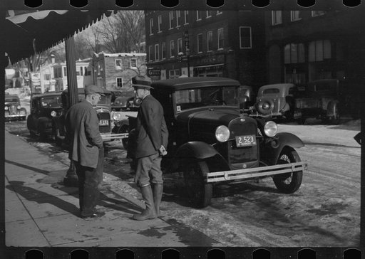 Untitled photo, possibly related to: Townspeople of Woodstock, Vermont, discussing the severe winter on the street corner in center of town