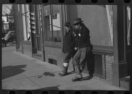 Untitled photo, possibly related to: Townspeople of Woodstock, Vermont, discussing the severe winter on the street corner in center of town