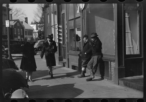 Untitled photo, possibly related to: Townspeople of Woodstock, Vermont, discussing the severe winter on the street corner in center of town
