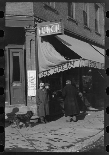 Untitled photo, possibly related to: Townspeople of Woodstock, Vermont, discussing the severe winter on the street corner in center of town
