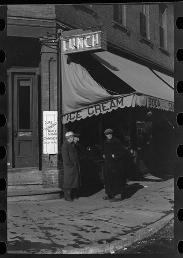 Untitled photo, possibly related to: Townspeople of Woodstock, Vermont, discussing the severe winter on the street corner in center of town