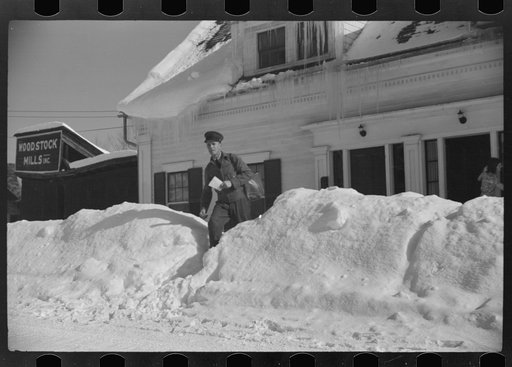Woodstock, Vermont(?). Mailman making deliveries after a heavy snowfall