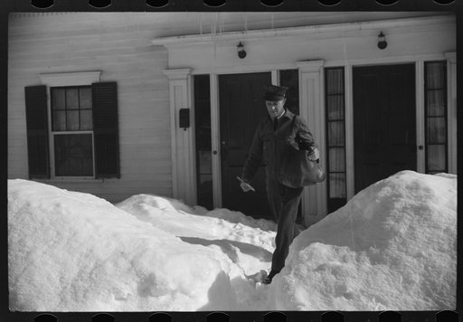 Untitled photo, possibly related to: Woodstock, Vermont(?). Mailman making deliveries after a heavy snowfall