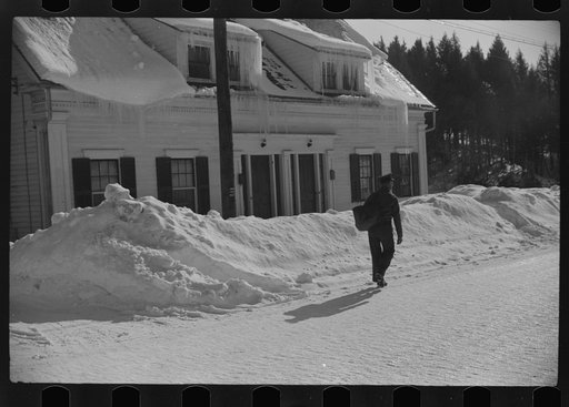 Untitled photo, possibly related to: Woodstock, Vermont(?). Mailman making deliveries after a heavy snowfall