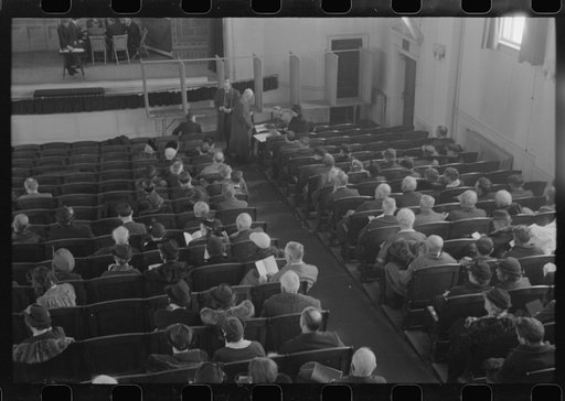 Townspeople listening to discussion and balloting during town meeting.  Woodstock, Vermont