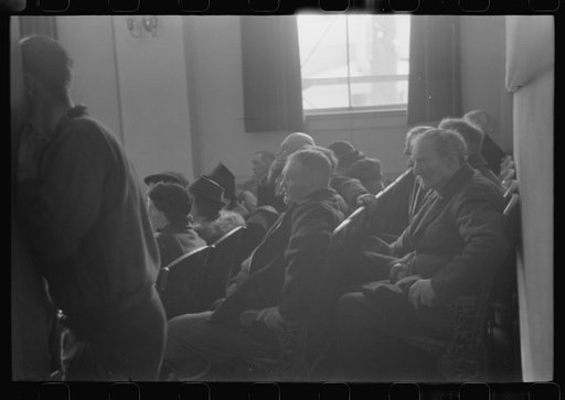 Untitled photo, possibly related to: Townspeople listening to discussion during town meeting, Woodstock, Vermont